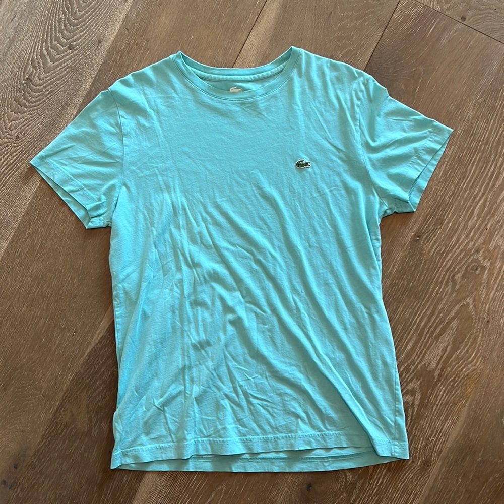Lightly used light blue Lacoste tee size 4